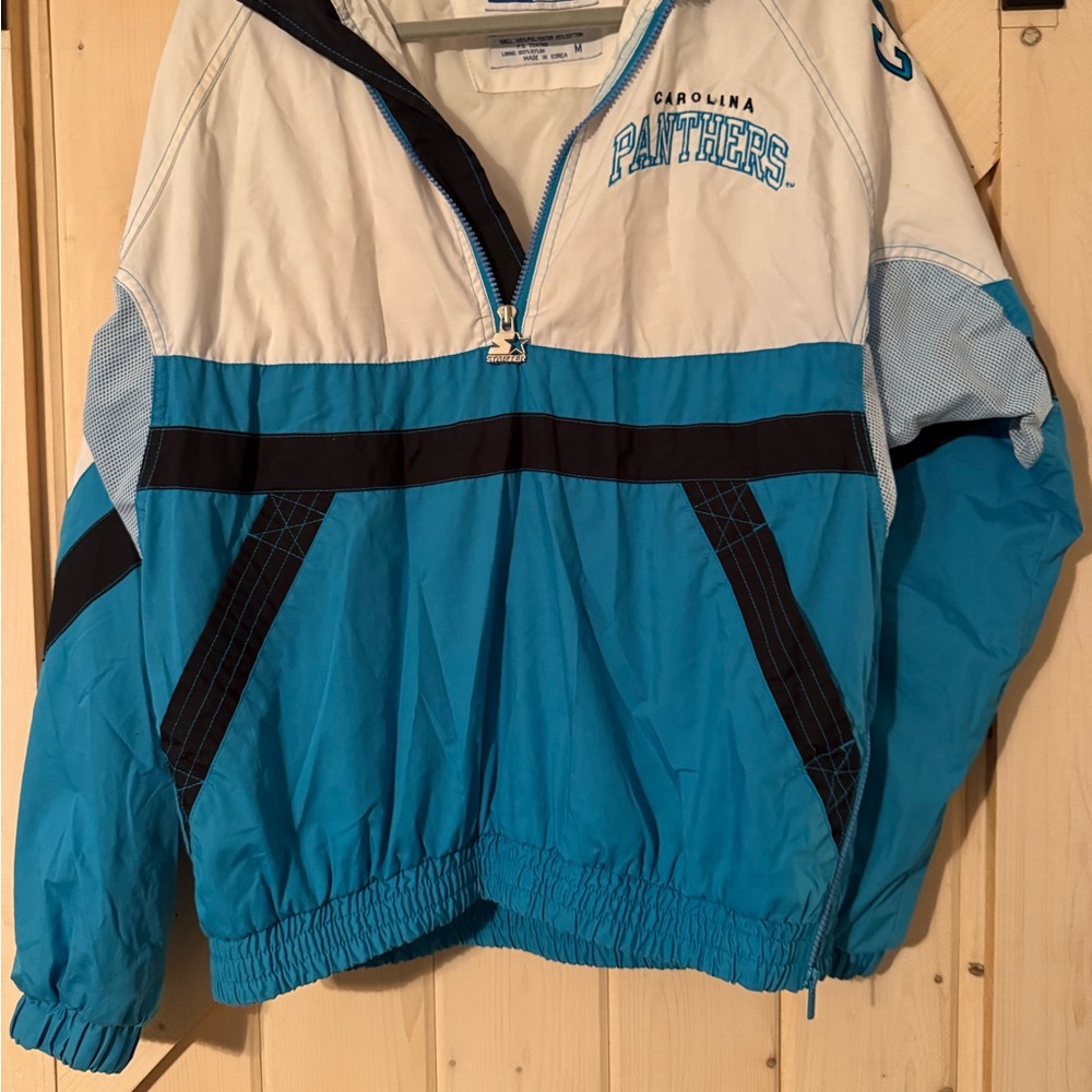 STARTER Carolina Panthers Teal, White & Black Windbreaker